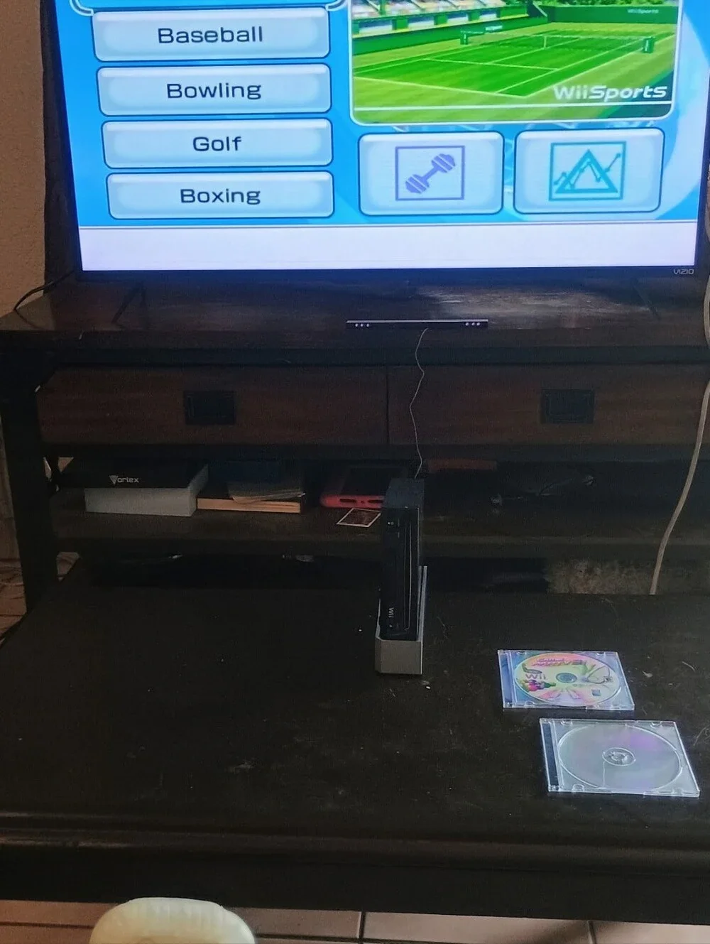 Nintendo Wii Bundle with 4 Games Black Console and White Controllers